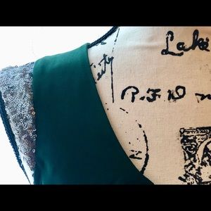 Deep green pleated mini dress.